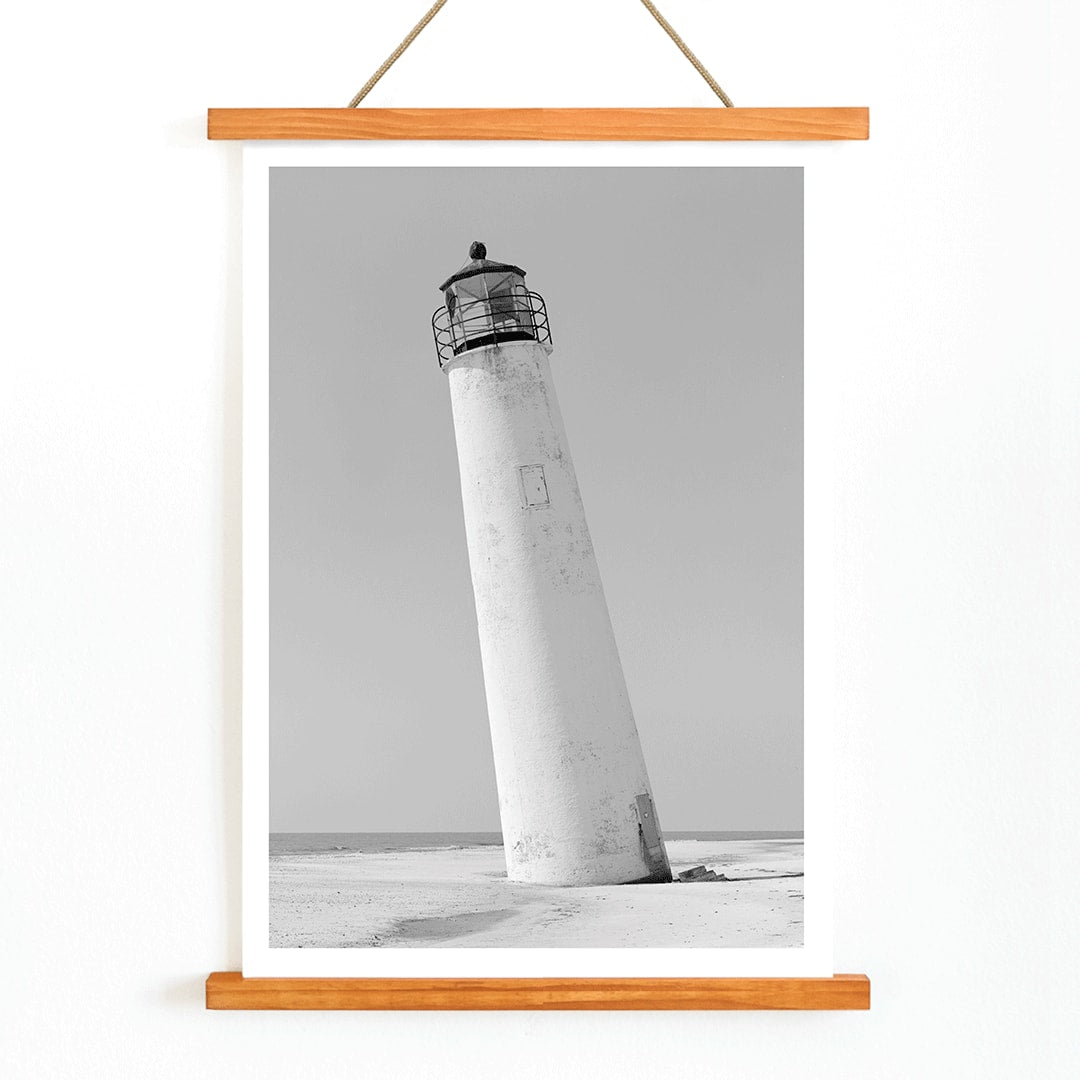 Cape Saint George Lighthouse poster featuring a tilted lighthouse on a sandy beach in Apalachicola Franklin County Florida, with wooden magnetic frame on white background