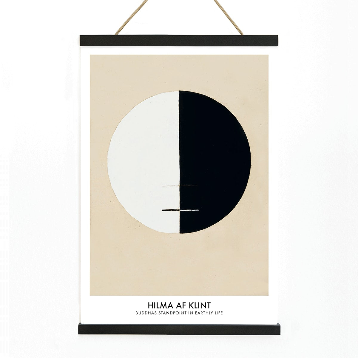 Black and white circle artwork poster Buddha Standpoint In Early Life by Hilma AF Klint with divided circle on beige background, with wooden magnetic frame on white background