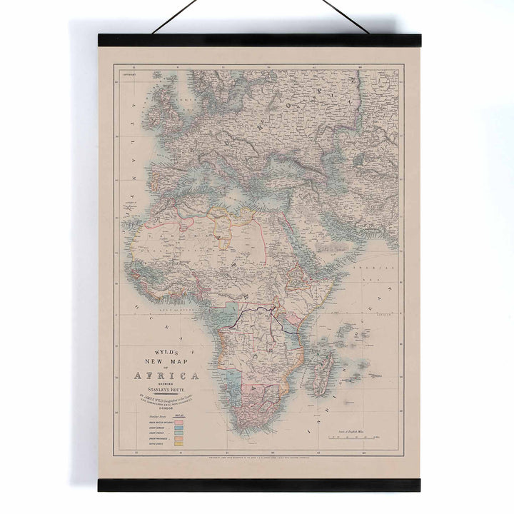 Wyld New Map of Africa vintage cartographic poster in beige grey blue and red tones, with wooden magnetic frame on white background