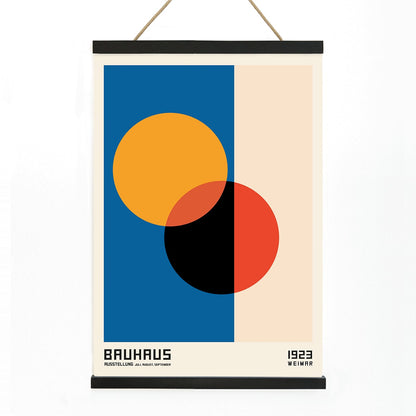 Bauhaus Poster 17 abstract geometric design with intersecting circles in orange red black on blue and beige background by Bauhaus artist framed with text at the bottom, with wooden magnetic frame on white background