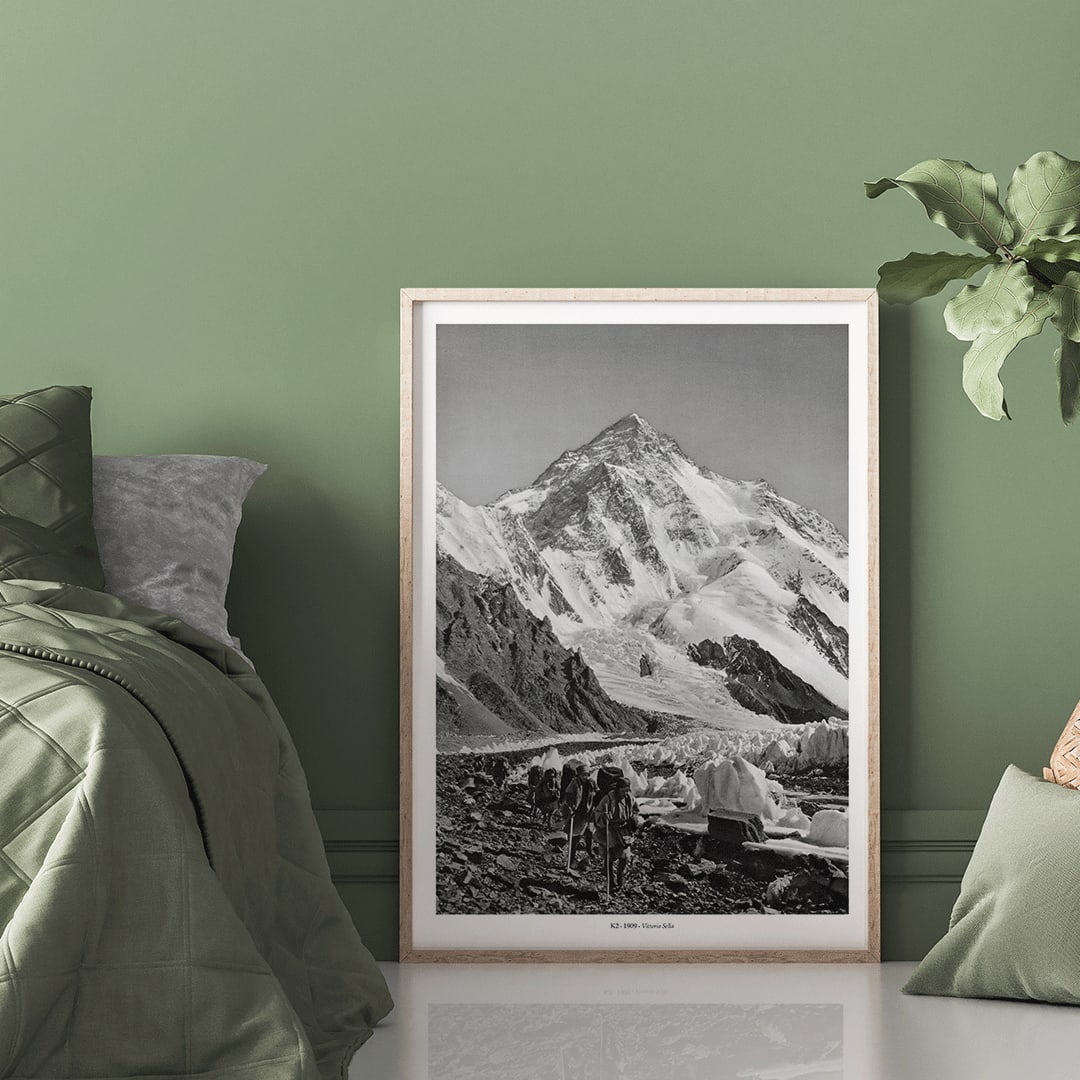 Black and white photo by Vittorio Sella of mountaineers trekking toward K2 over the Godwin Austen glacier titled Le pic K2 vue prise du glacier Godwin Austen, framed and displayed in home decor