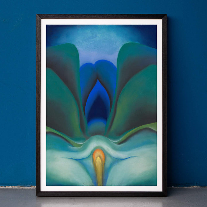 Georgia OKeeffe Blue Flower poster luminous blue and green abstract bloom with soft yellow center, framed and displayed in home decor