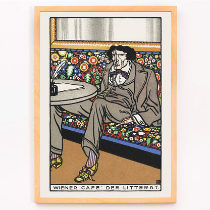 Poster of a man lounging in an ornate Viennese café setting on a floral bench at a table titled Viennese Café The Man of Letters by Moriz Jung, framed and displayed in modern living room decor