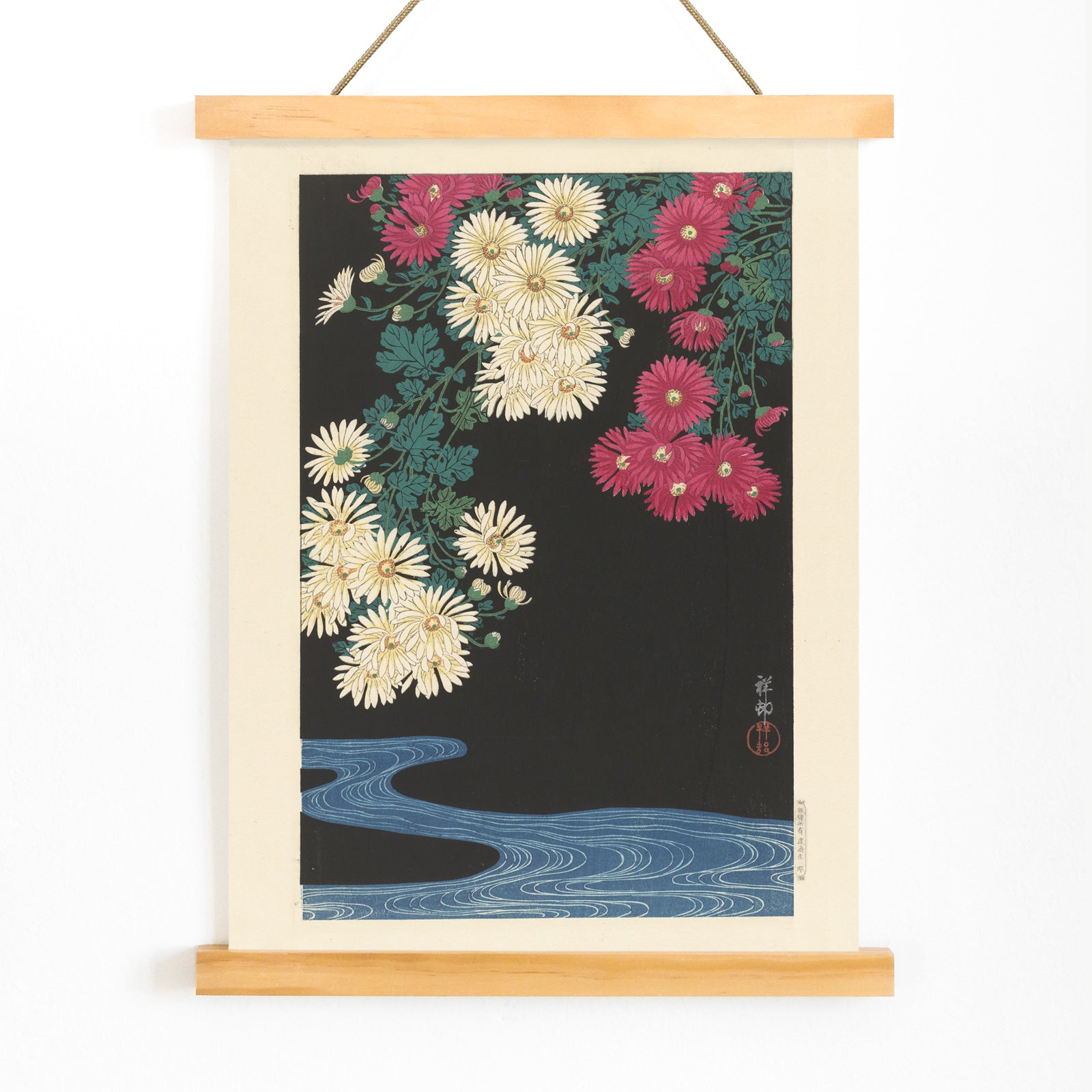 Chrysanthemums and Running Water by Ohara Koson Japanese art poster with yellow and pink flowers over blue water on black background, with wooden magnetic frame on white background