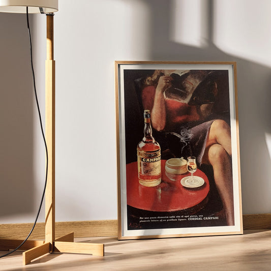 Cordial Campari vintage posters by Miroglio and Nizzoli featuring women relaxing with drinks magazines and bottles, framed and displayed in home decor