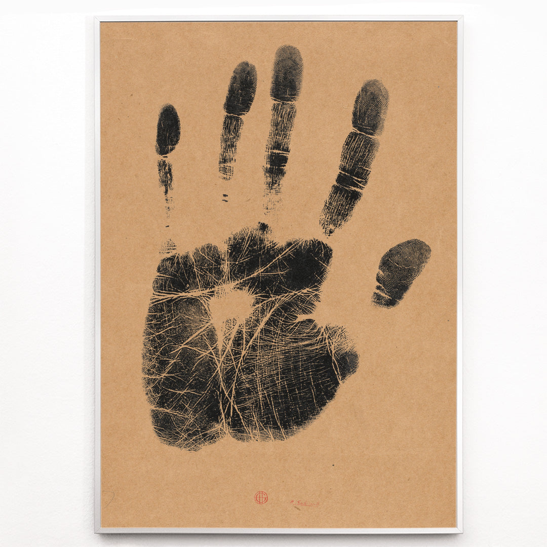 Closeup detail of Black ink handprint artwork titled The Artists Left Hand by Henri Charles Guerard on beige background