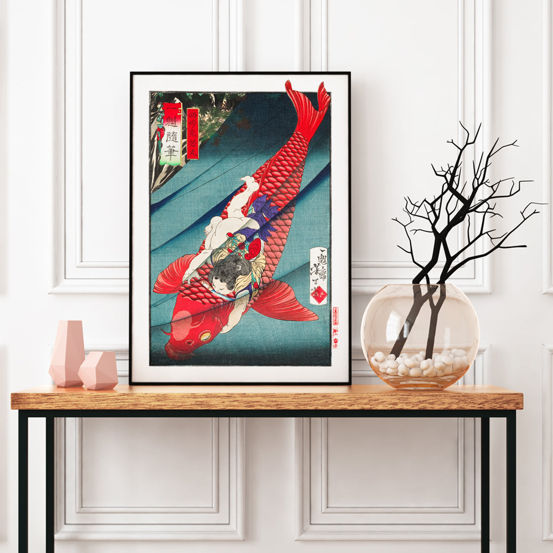 Young boy holding and wrestling a giant red koi fish in vibrant Japanese woodblock print Saito no Oniwakamaru by Tsukioka Yoshitoshi, framed and displayed in home decor