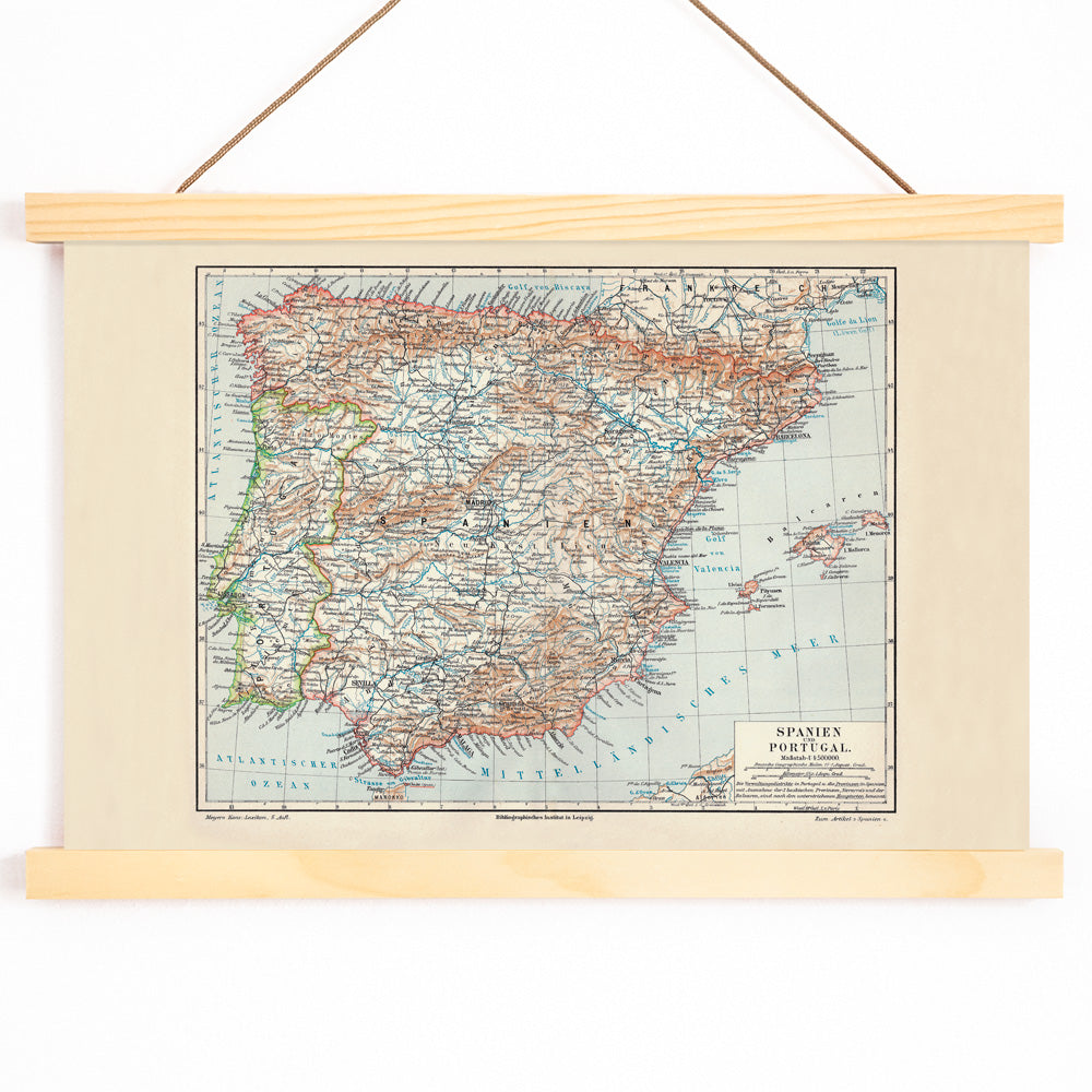 Ancient vintage map of Spain and Portugal with detailed regions and borders by Bibliographic institute of Liepzig poster artwork, with wooden magnetic frame on white background