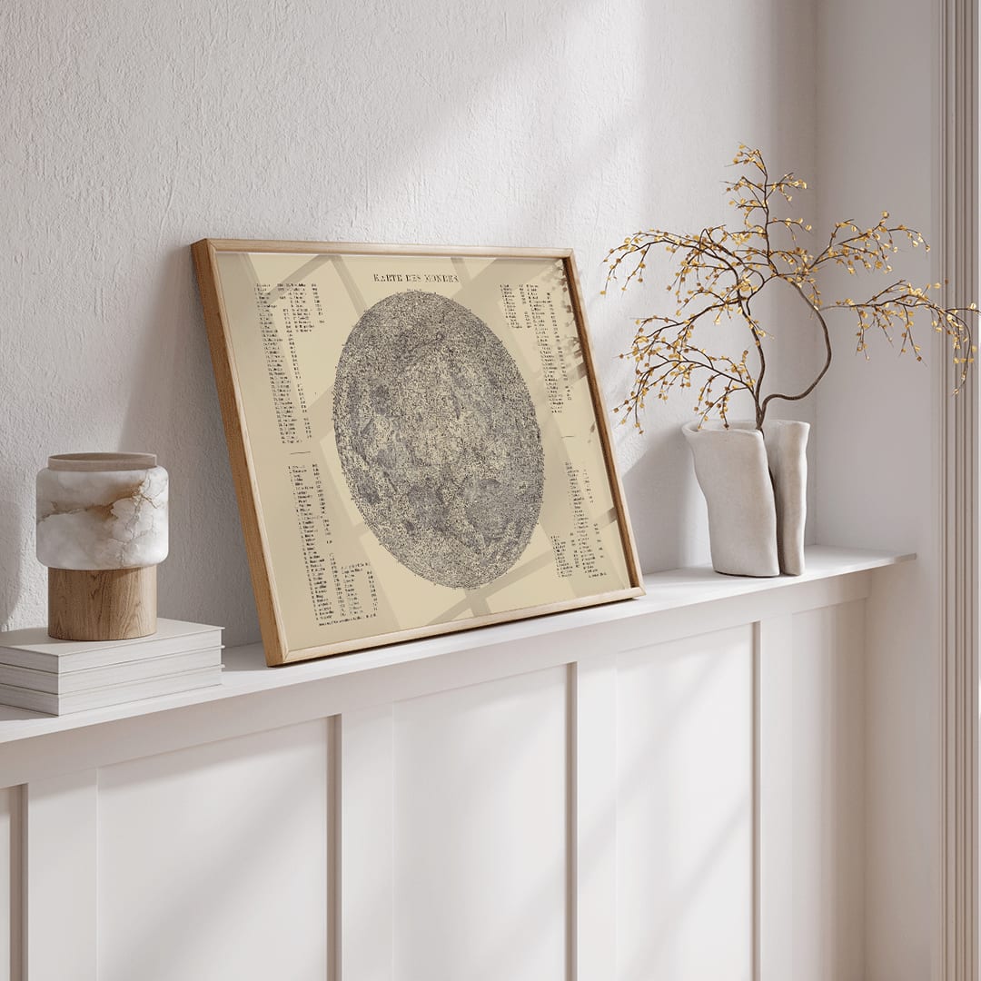 Detailed lunar surface illustration and poster with labeled features titled Map of the Moon by The Institute of Liepzig artwork, framed and displayed in home decor