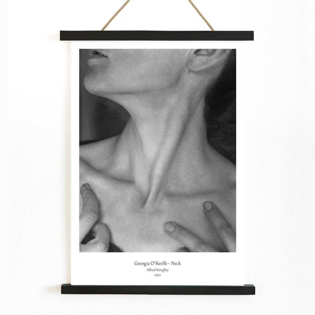 Black and white portrait of Georgia O Keeffe neck and hands by Alfred Stieglitz wall art poster photography decor, with wooden magnetic frame on white background