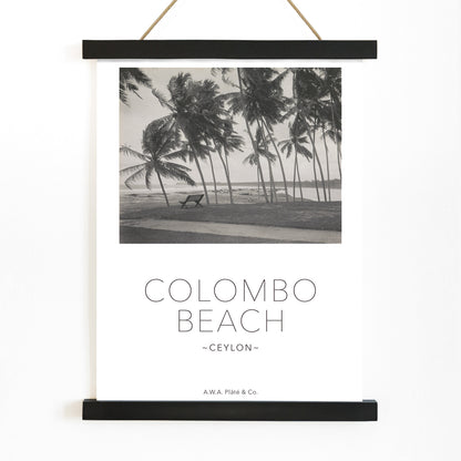 Colombo Beach Ceylon poster with palm trees and empty bench artwork by AWA Plate and Co ideal for wall decor and travel themes, with wooden magnetic frame on white background