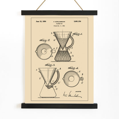 Vintage technical drawing and poster of coffee filter pot patent by P Schlumbohm with schematic and design details, with wooden magnetic frame on white background