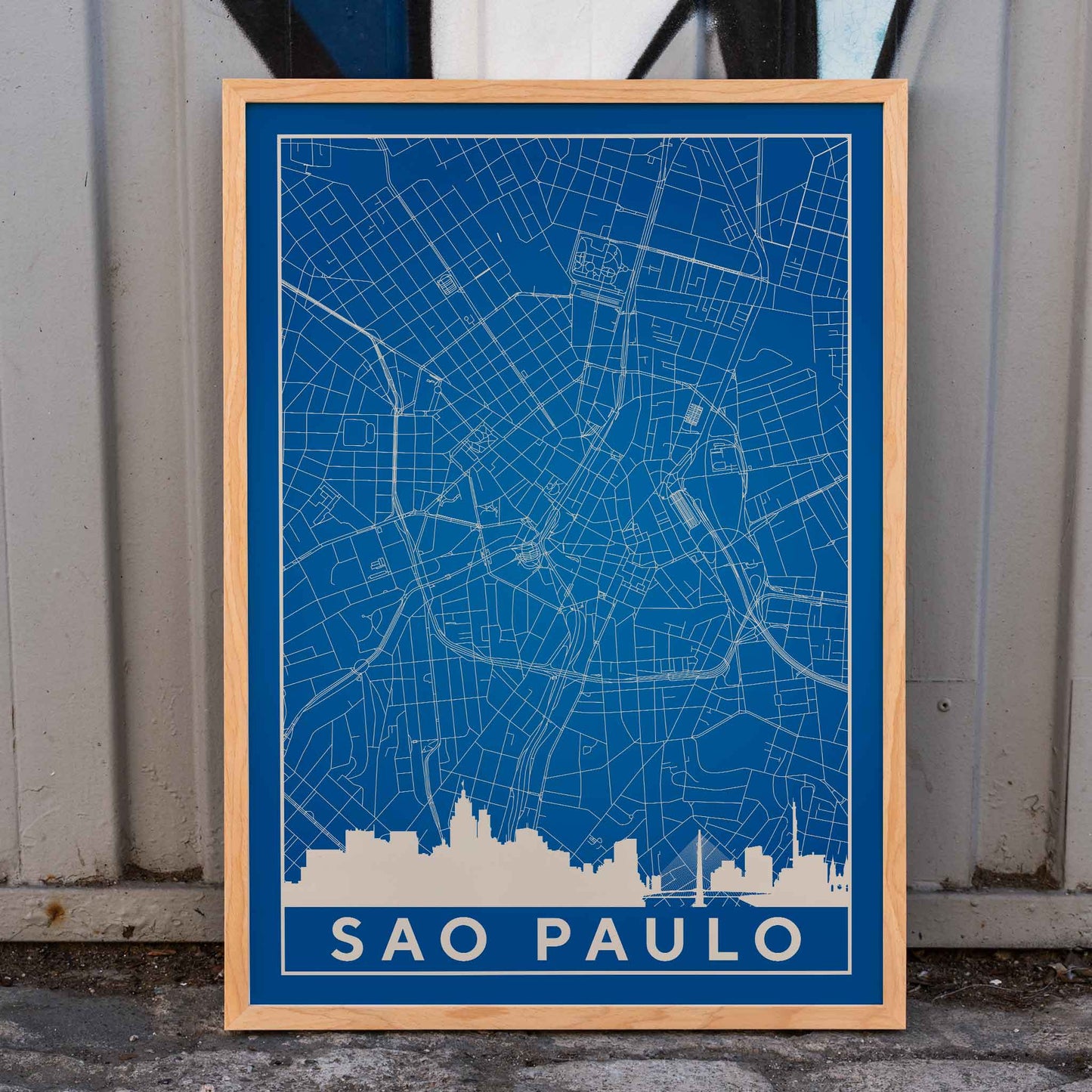 Minimalist blue map of Sao Paulo city with white street lines and skyline by artist Anonymous titled Minimalist Sao Paulo Map, framed and displayed in home decor