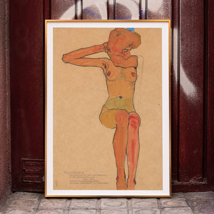 Seated female nude in expressive style Mädchenakt Gertrude by Egon Schiele poster featuring a nude figure in a seated pose with expressive lines and color, framed and displayed in home decor