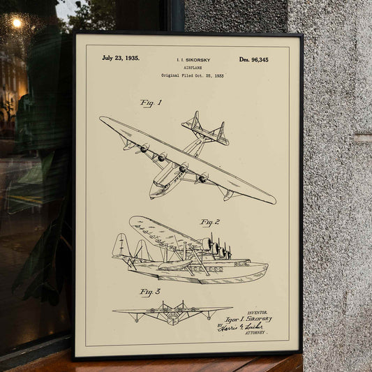 Detailed technical drawing and poster of a seaplane airplane patent by Igor I Sikorsky featuring multiple views and aircraft design sketches, framed and displayed in home decor