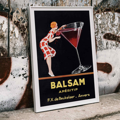 Balsam Aperitif poster by Jean d Ylen showing a woman sipping from a giant red cocktail glass vibrant vintage art, framed and displayed in home decor