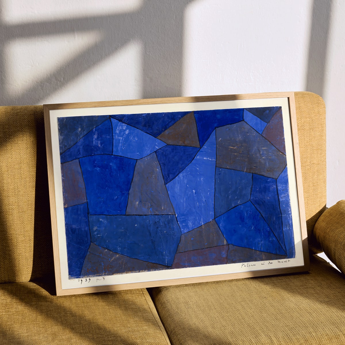 Blue geometric abstract artwork titled Rocks at Night by Paul Klee featuring varied shades and textures poster, framed and displayed in modern living room decor