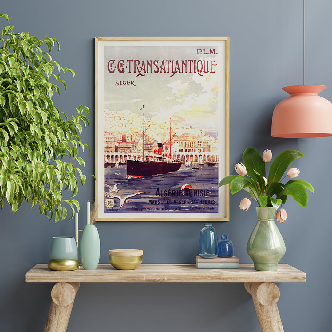 Vintage steamship in Algiers harbor with city buildings travel poster by Fernand Le Quesne Cie Cle Transatlantique, framed and displayed in home decor