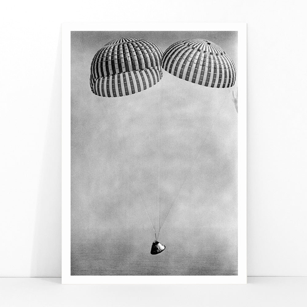 Apollo 9 spacecraft with astronauts McDivitt Scott and Schweickart descending toward Atlantic splashdown with parachutes NASA recovery poster, framed and displayed in modern living room decor