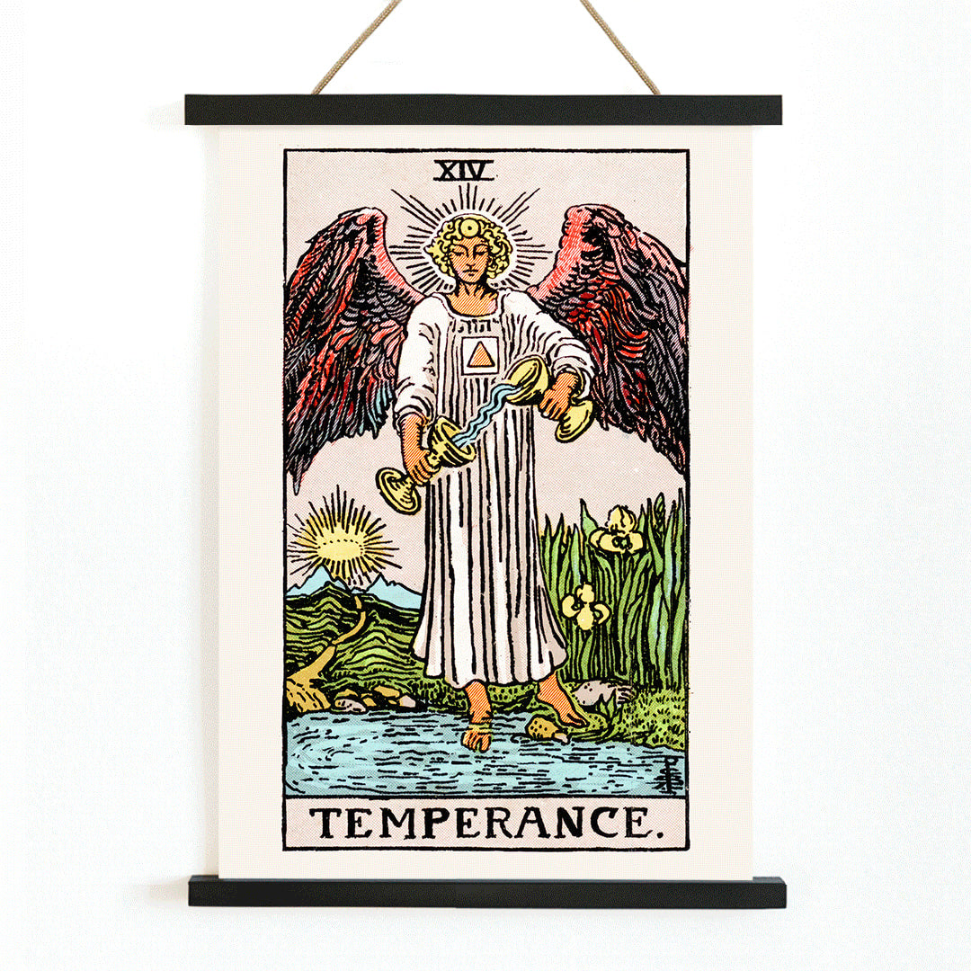Temperance tarot card by Rider Waite featuring an angel with wings pouring liquid between two cups illustration and poster, with wooden magnetic frame on white background