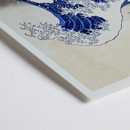 Closeup detail of The Great Wave off Kanagawa by Katsushika Hokusai showing a dramatic large wave threatening small boats with Mount Fuji in the background