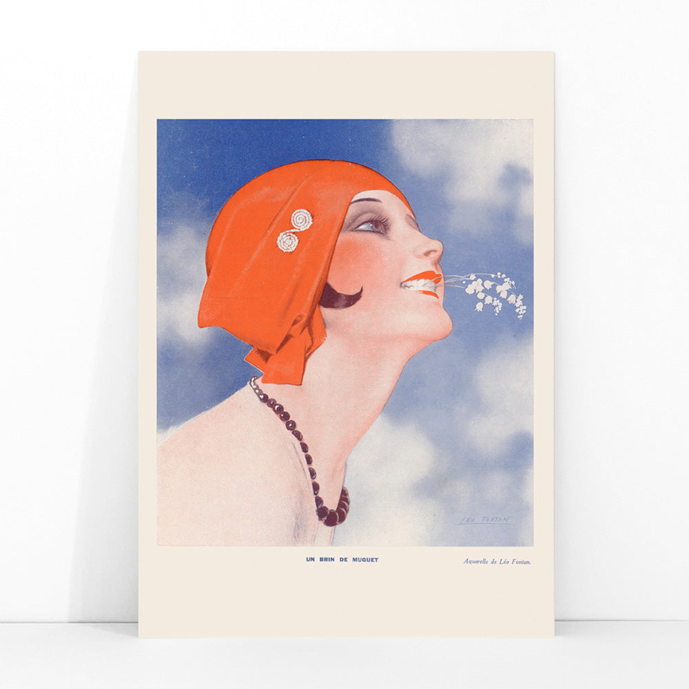 Poster of Un Brin de Muguet by Leo Fontan showing a smiling woman in a red headscarf holding lily of the valley in her mouth, framed and displayed in modern living room decor